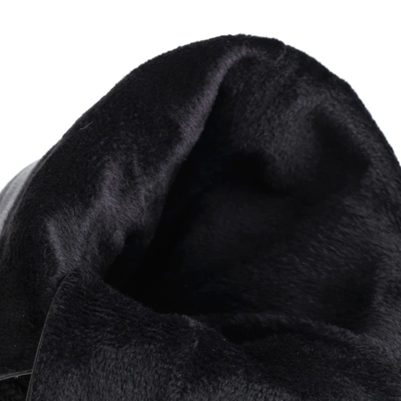 Close-up of the soft, plush interior of women's gothic black high boots with lace-up design.