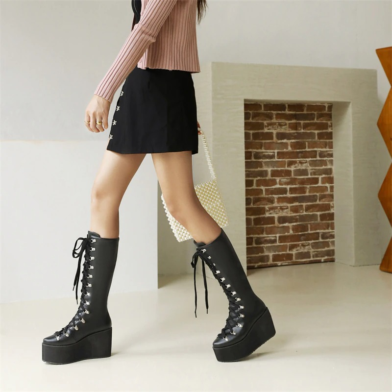 Stylish women's gothic black platform boots with lace-up detail, perfect punk fashion for any outfit.