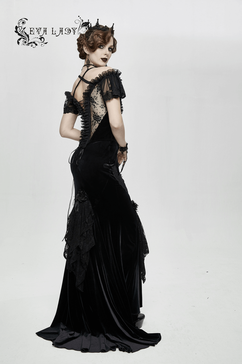 Elegant gothic woman in a black transparent corset dress with lace details, showcasing a vintage-inspired style.