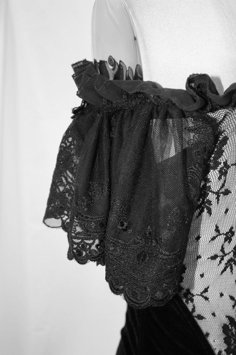 Close-up of elegant black lace ruffle on a women's gothic corset, showcasing intricate details and style.