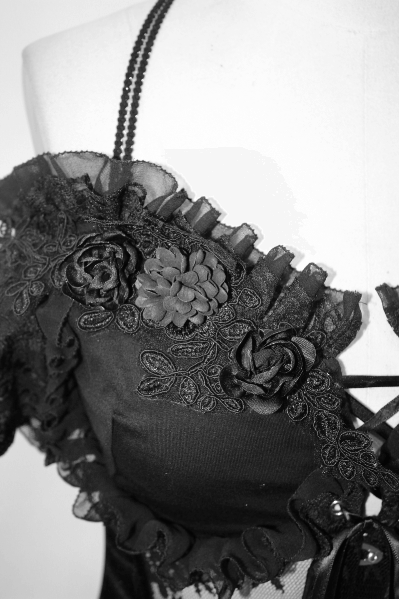 Close-up of women's transparent corset with lace and flower details in gothic style, highlighting elegance and fashion.