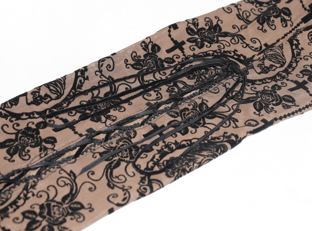 Close-up of women's apricot transparent leggings with black lace pattern and stylish lacing detail.