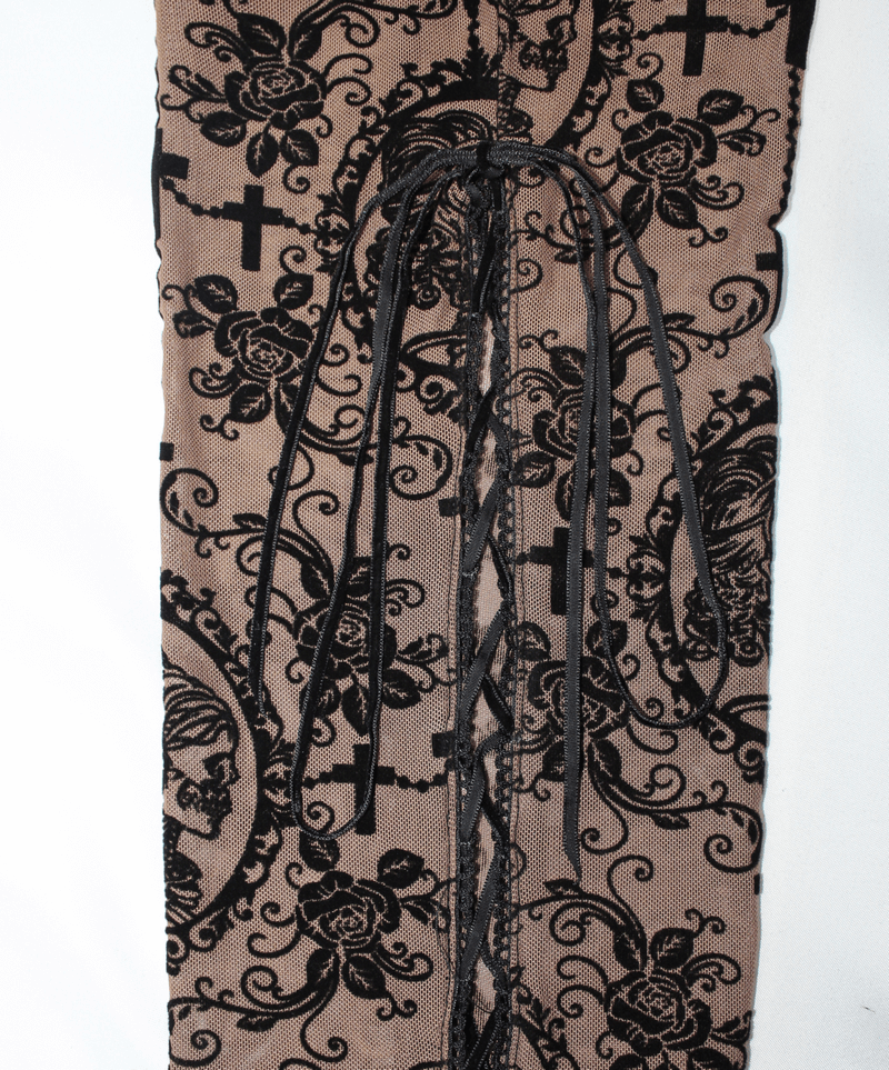 Close-up of women's apricot leggings featuring gothic lace design and stylish lace-up detail.