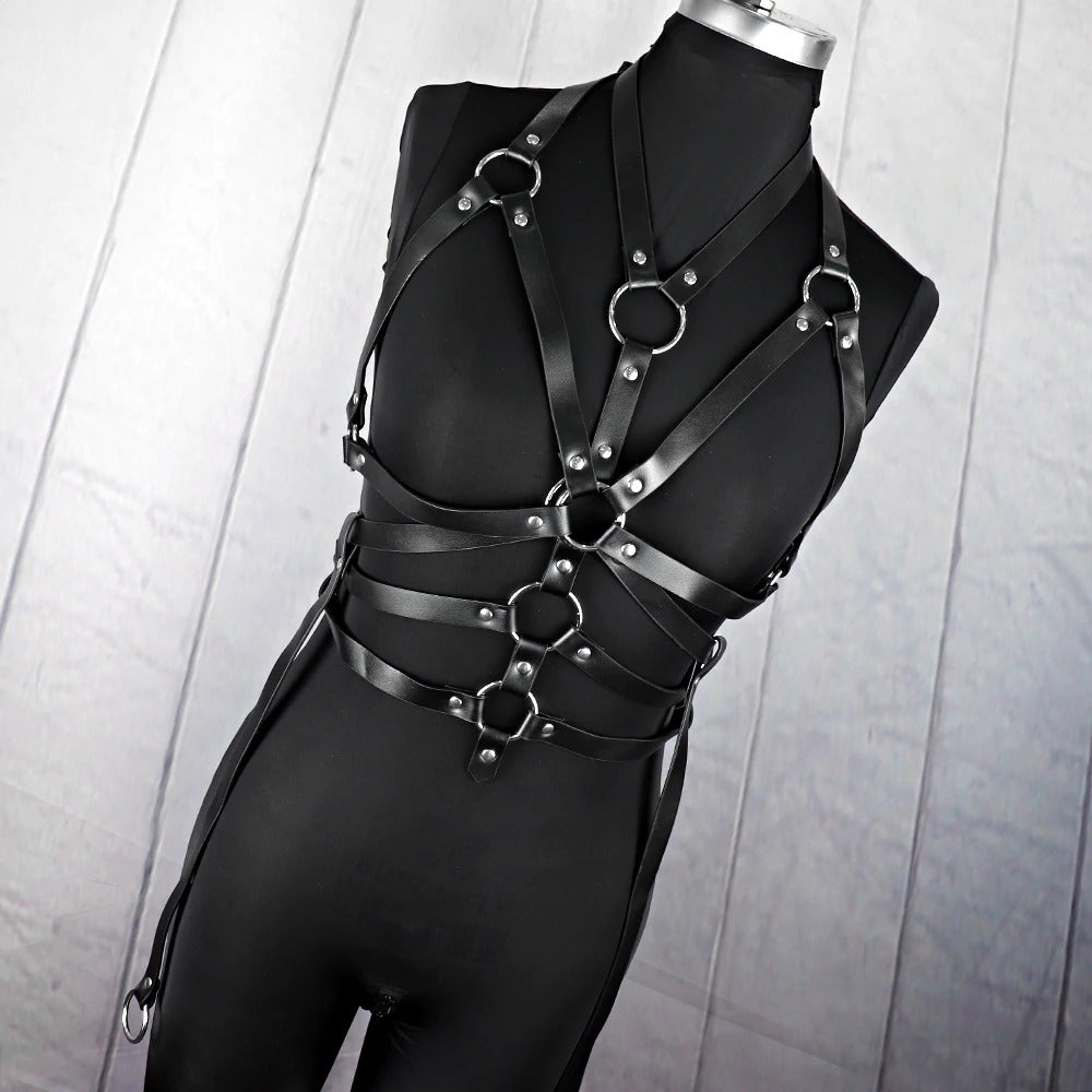 Women's gothic bondage garter belt and straps in classic black, featuring metal rings for a fierce fashion statement.