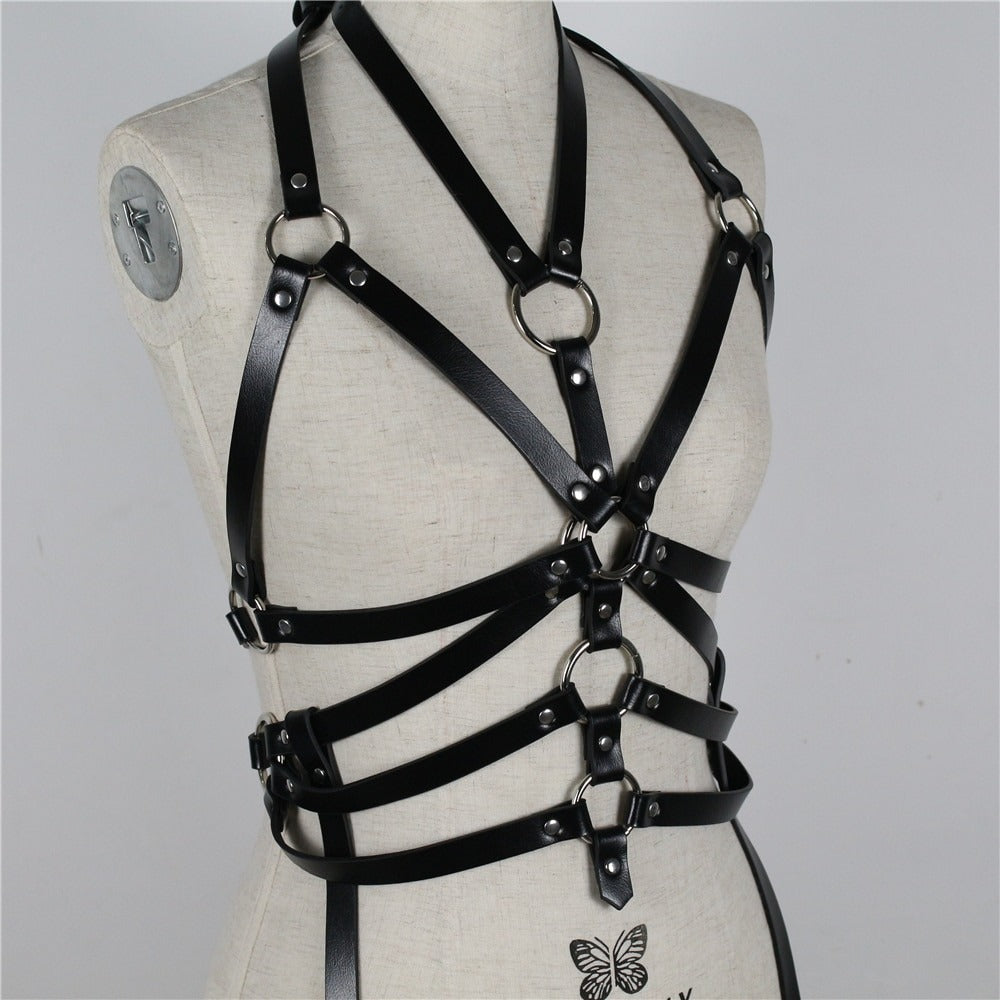 Women's black bondage garter belt with metal rings, perfect for gothic fashion and intimate body accessories.