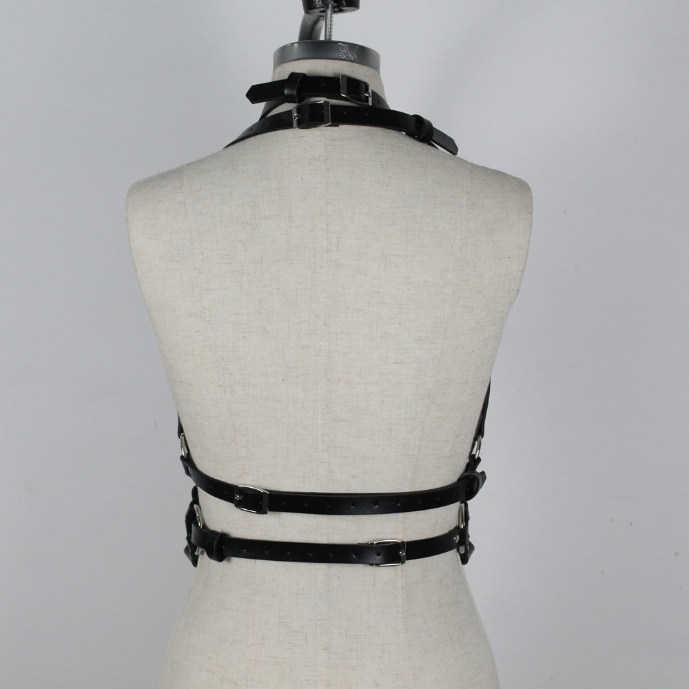 Back view of women's bondage garter belt, featuring straps and metal rings for a gothic fashion statement.