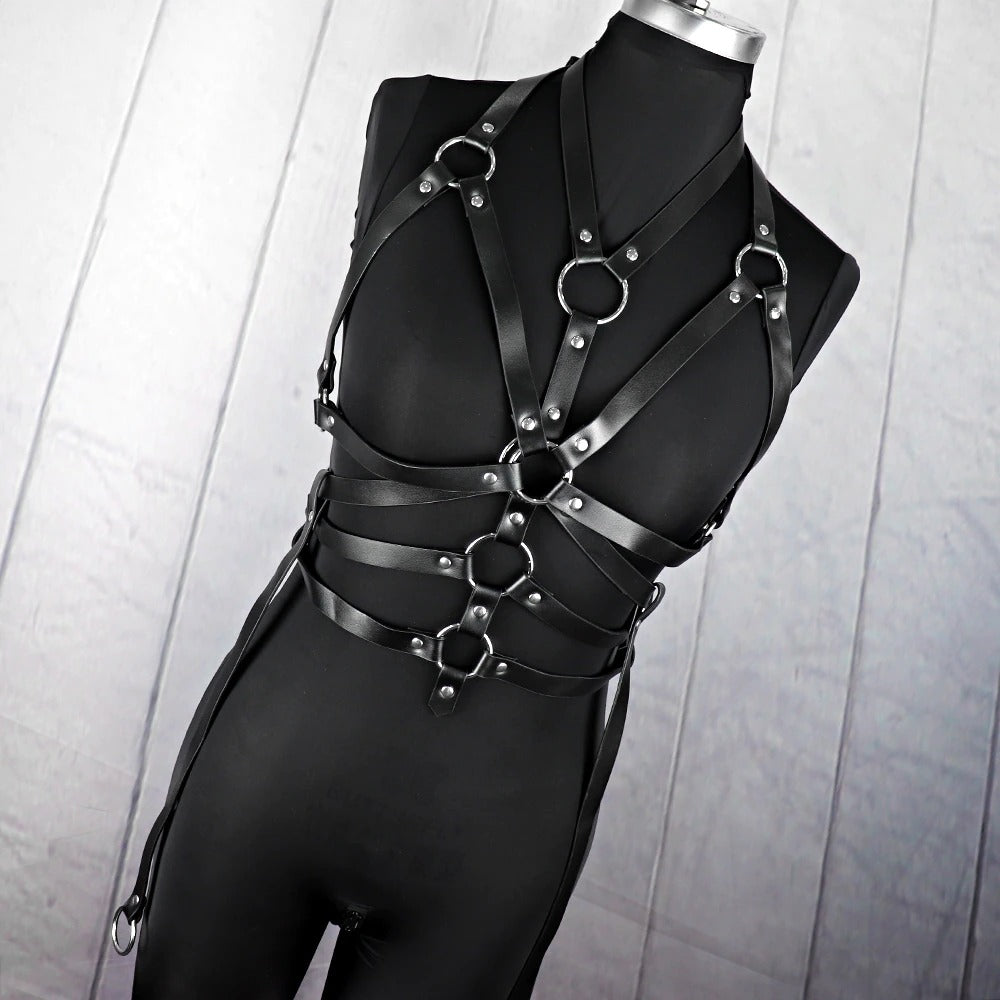 Black bondage garter belt with metal rings, featuring an edgy gothic design for a fierce look.