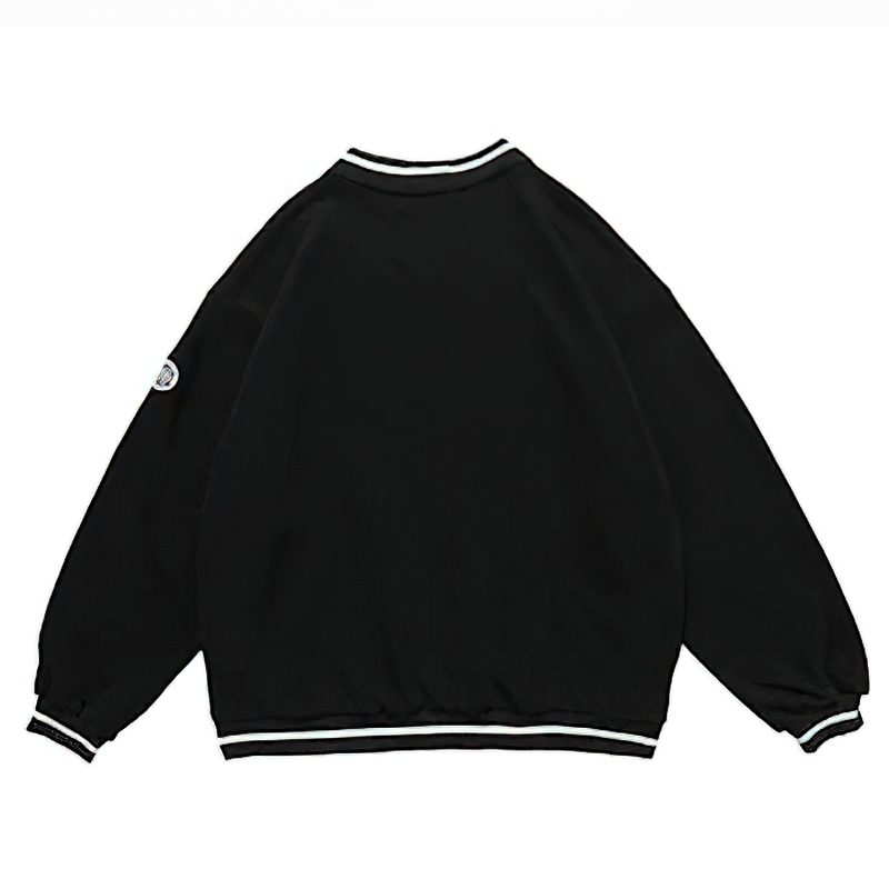 Back view of women's oversized black V-neck sweatshirt with sporty stripes and letter patch detail.