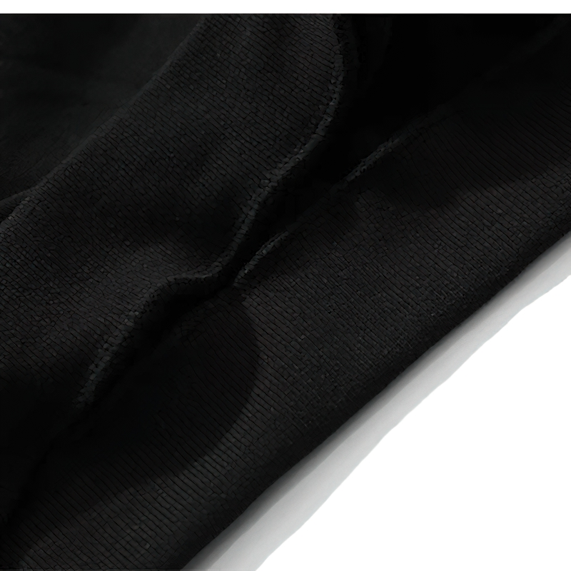 Close-up of black fabric detail of women's oversized V-neck baseball sweatshirt.