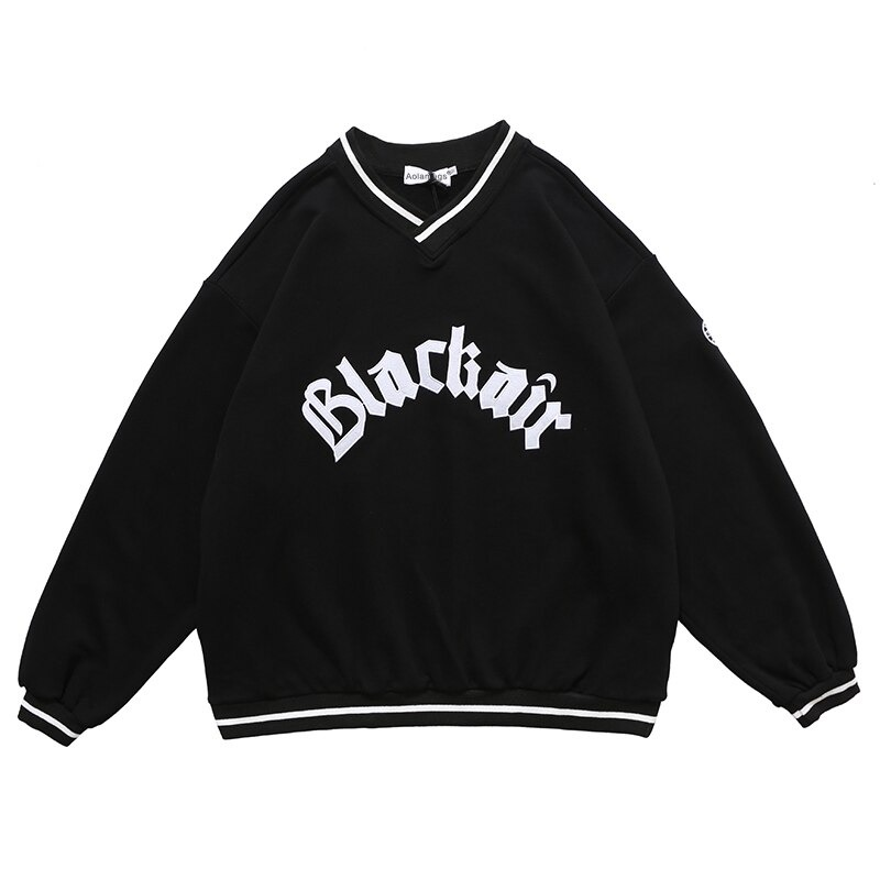 Women's oversized black V-neck sweatshirt with 'Blackair' letter patch and striped cuffs, trendy casual style.