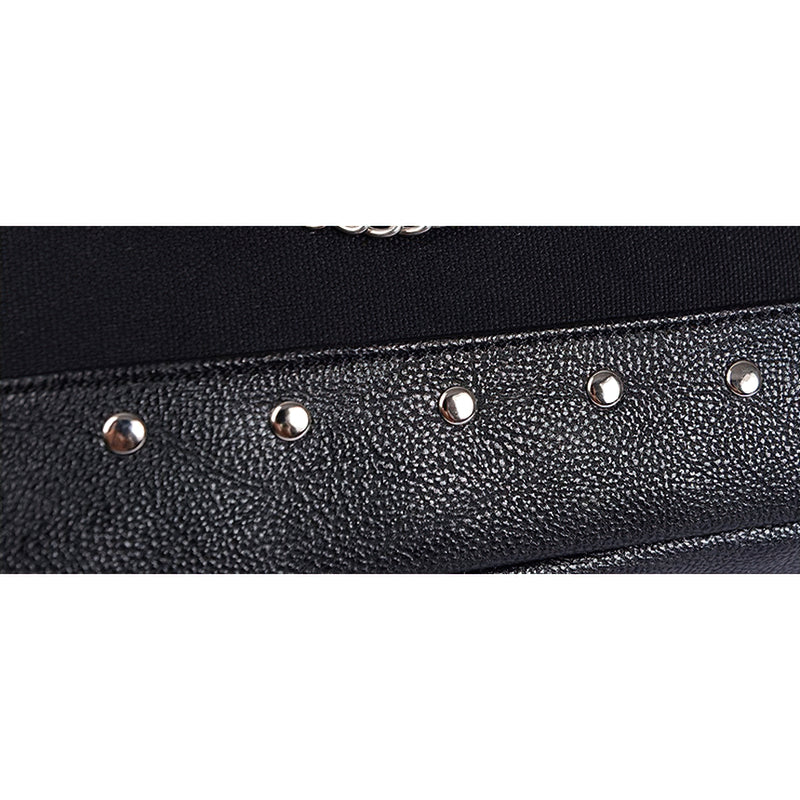Close-up of stylish rivets on women's vintage tote bag, highlighting gothic details and edgy design.