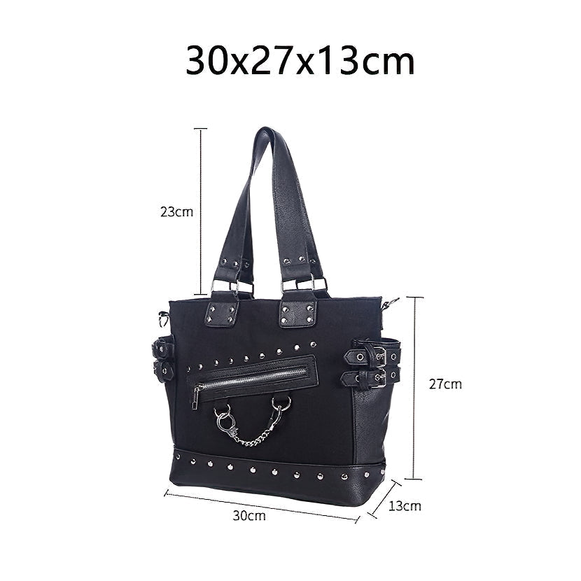 Stylish women's vintage rivet tote bag featuring a zipper and handcuffs, perfect for gothic fashion enthusiasts.
