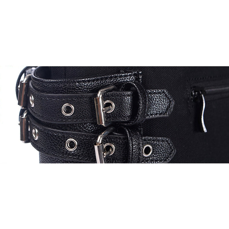 Close-up of vintage women's tote bag featuring rivets, buckles, and zippers for a gothic style.