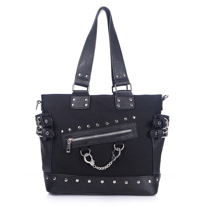Women's vintage rivet tote bag with zipper and handcuffs, featuring gothic style details and multiple straps.