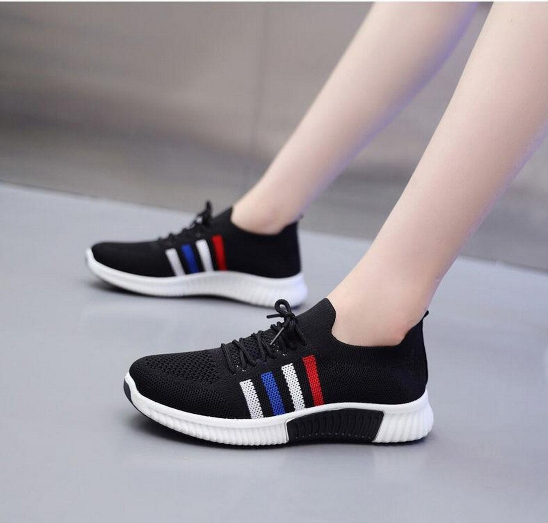 Women's black vulcanized sneakers with colorful stripes, perfect for casual running and breathable comfort.