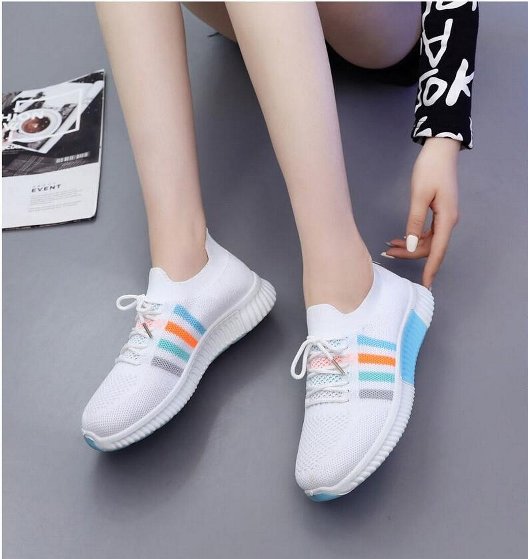 Women's breathable vulcanized sneakers in white with colorful stripes, perfect for casual running and sports activities.