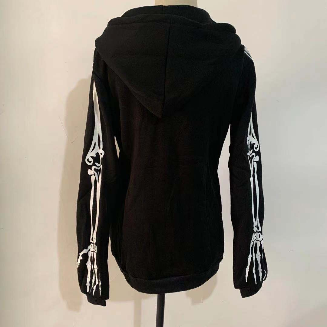 Black women's hoodie with skeleton print on sleeves, featuring a hood and zipper for a gothic style.