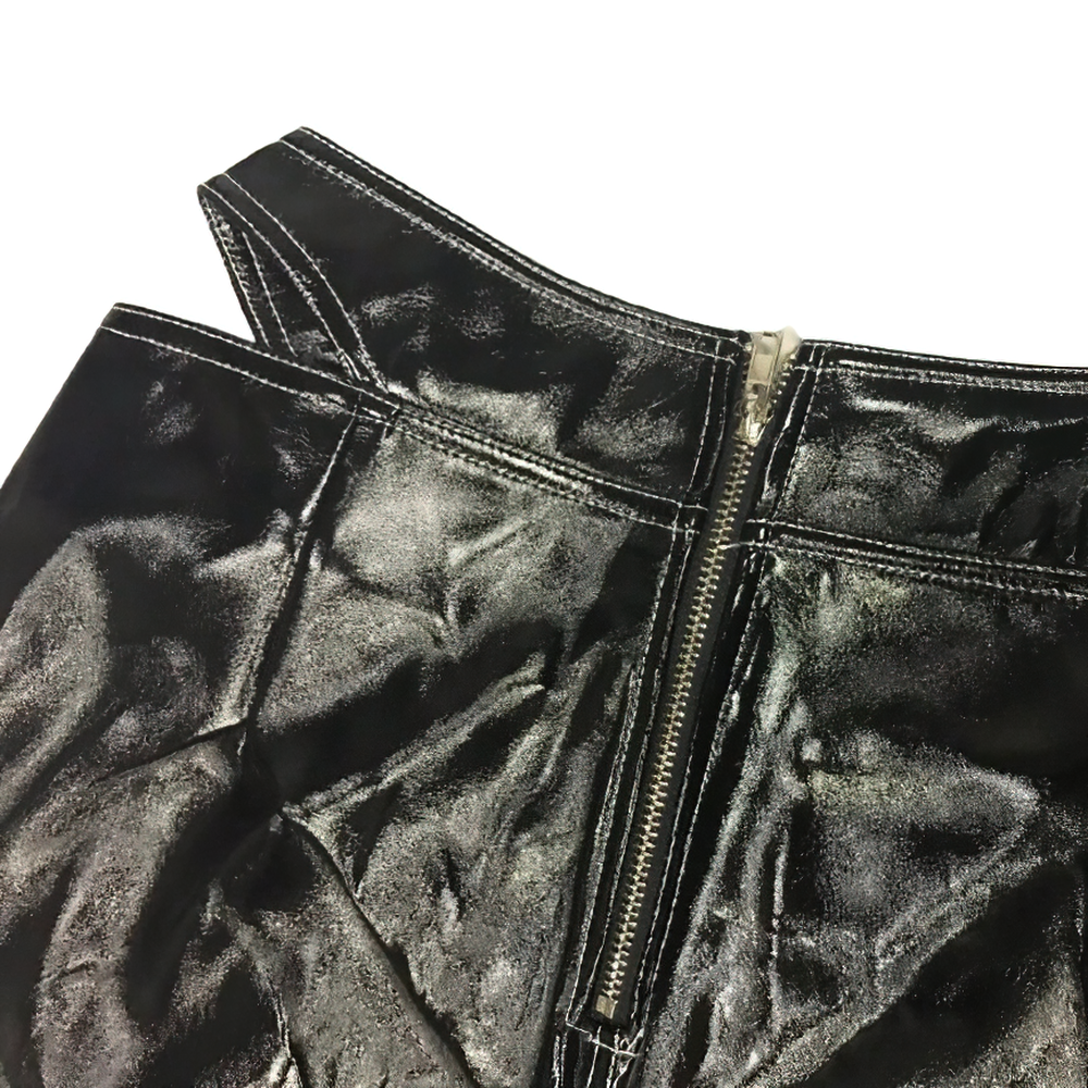 Close-up of women's black PU leather pants featuring a stylish silver zipper and contrast stitching details.