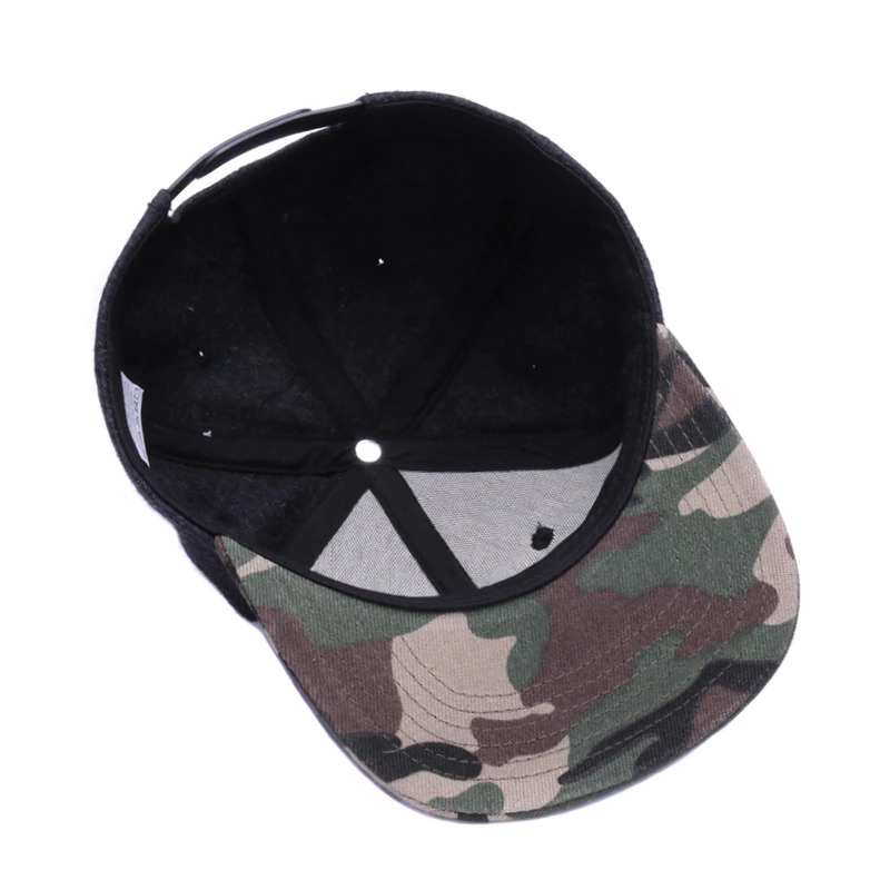 Interior view of a black snapback baseball cap with a camo flat brim, perfect for casual rock punk style outfits.