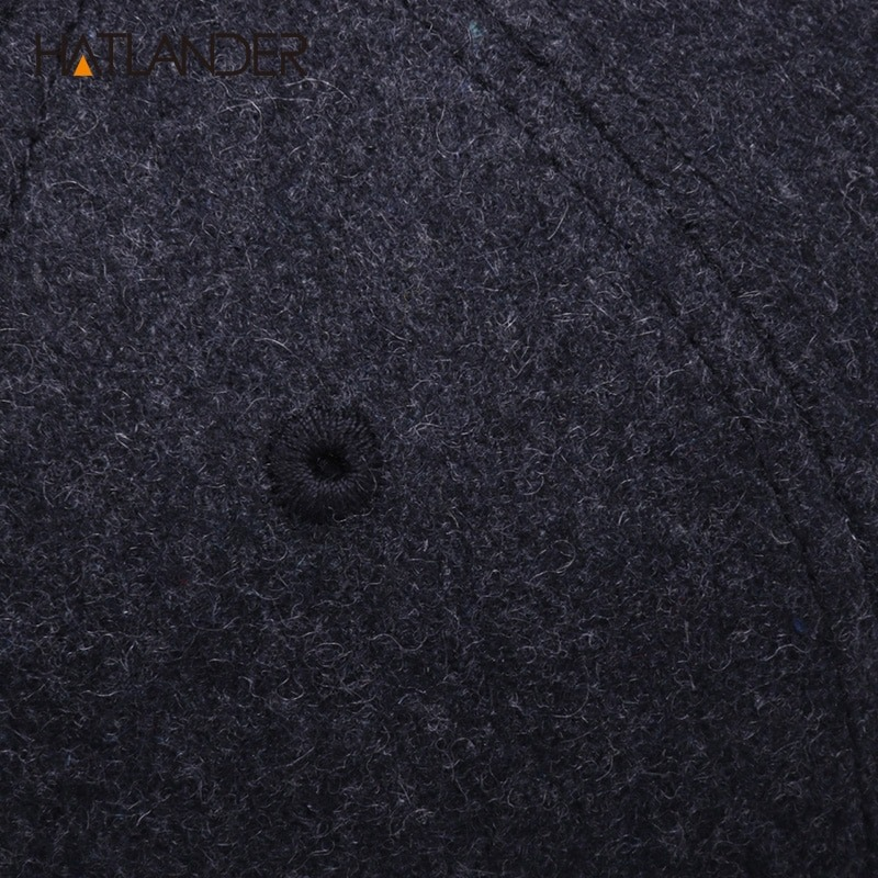 Close-up of a black wool snapback cap, showcasing its soft texture and modern Rock Punk design for both men and women.