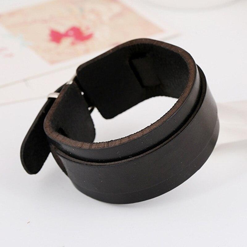 Stylish double wide black leather cuff bracelet for men and women, a trendy accessory for any outfit.