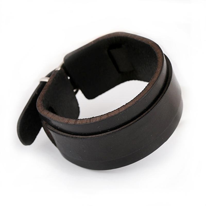 Double wide black leather cuff bracelet, trendy unisex wristband with copper alloy accents for stylish outfits.
