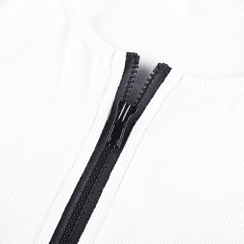 Close-up of the sleek black zipper on a white women's one-piece bodysuit, perfect for summer outings.