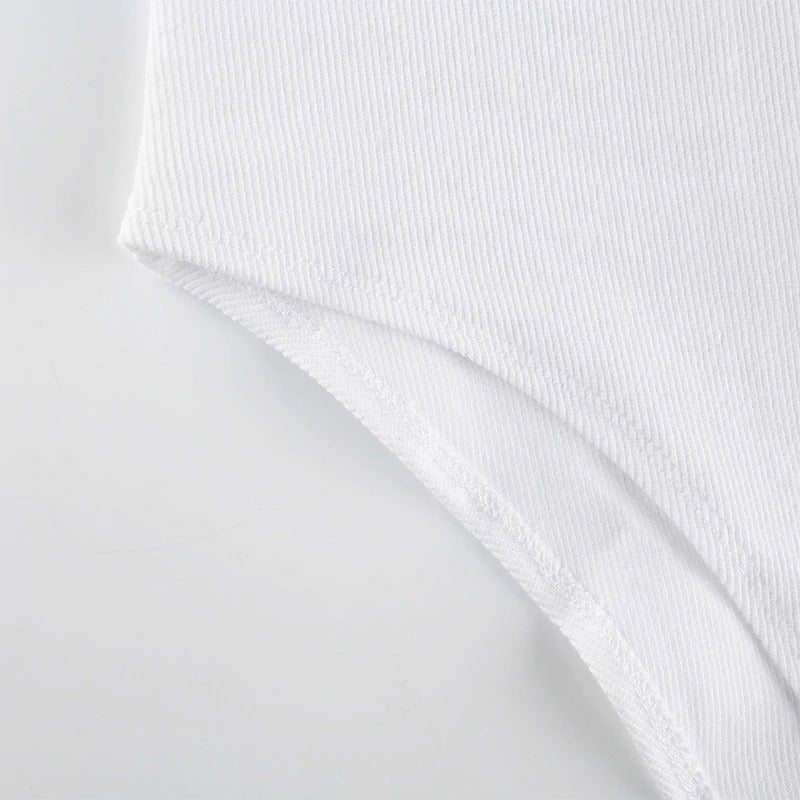Close-up of the white fabric detail on a women's zipper bodysuit, highlighting its soft texture and sleek design.